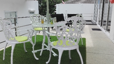 1 ° Terrace with living room, parasol, lawn 